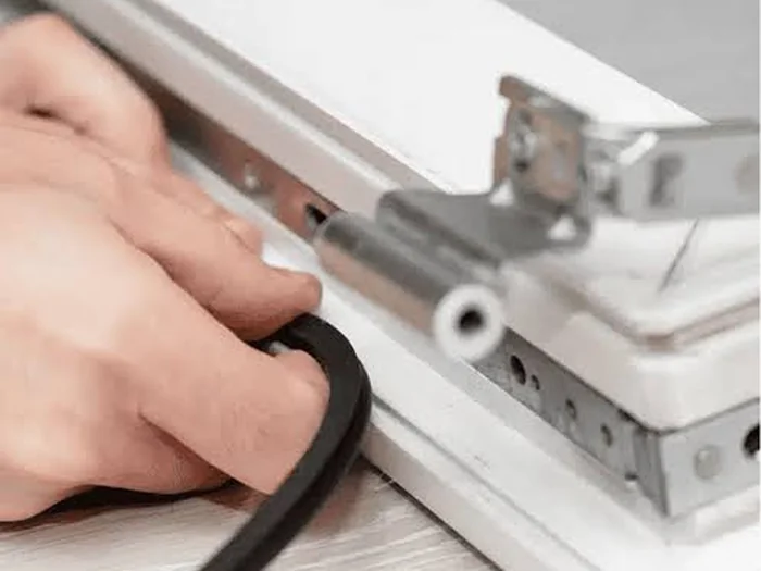 Close-up detail of an aluminium sliding door frame and lock mechanism