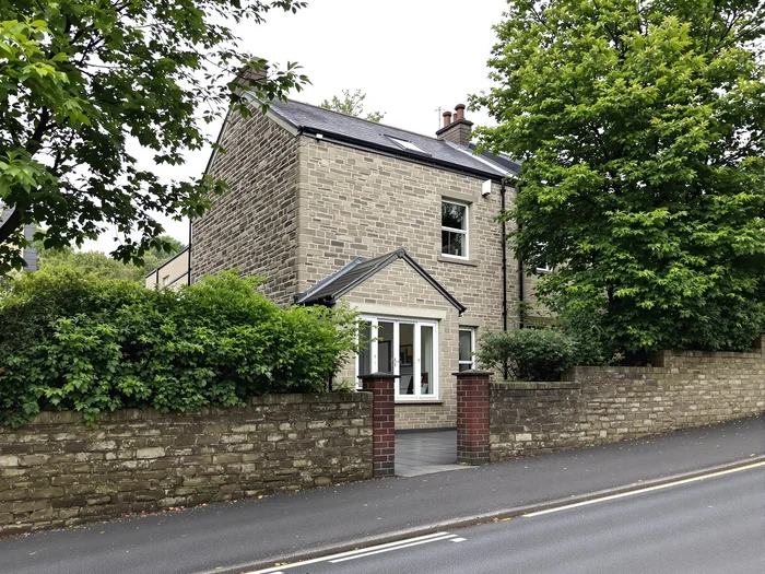Stone-built Sheffield home on a sloping street with patio doors